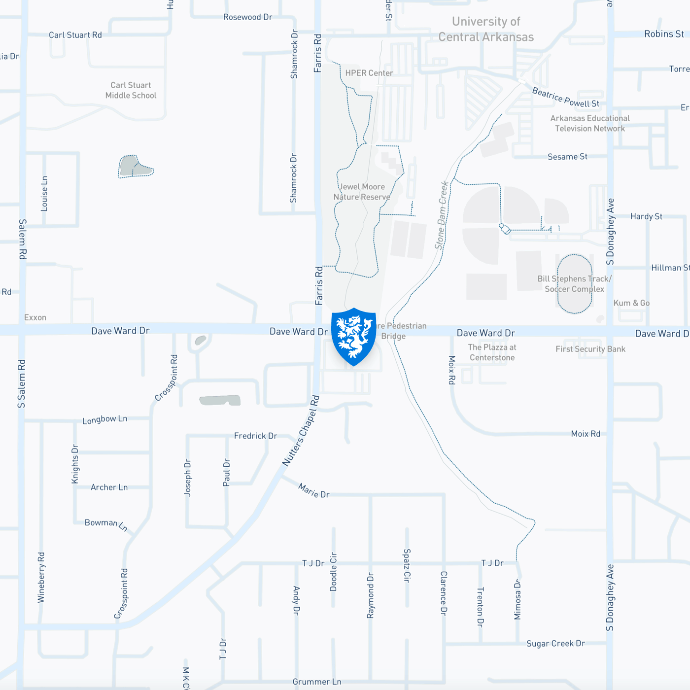 shield logo icon in center of map marking location of clinic